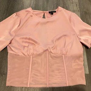 Shinestar corset-like satin shirt with sheer panel.